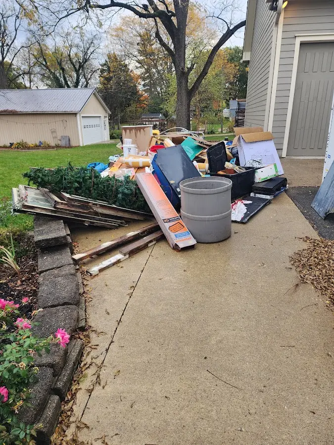 Dumpster being loaded with debris for Commercial Dumpster Rental in Lake Butler